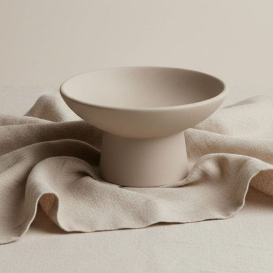 Pedestal Candle holder in Taupe finish on beige linen cloth