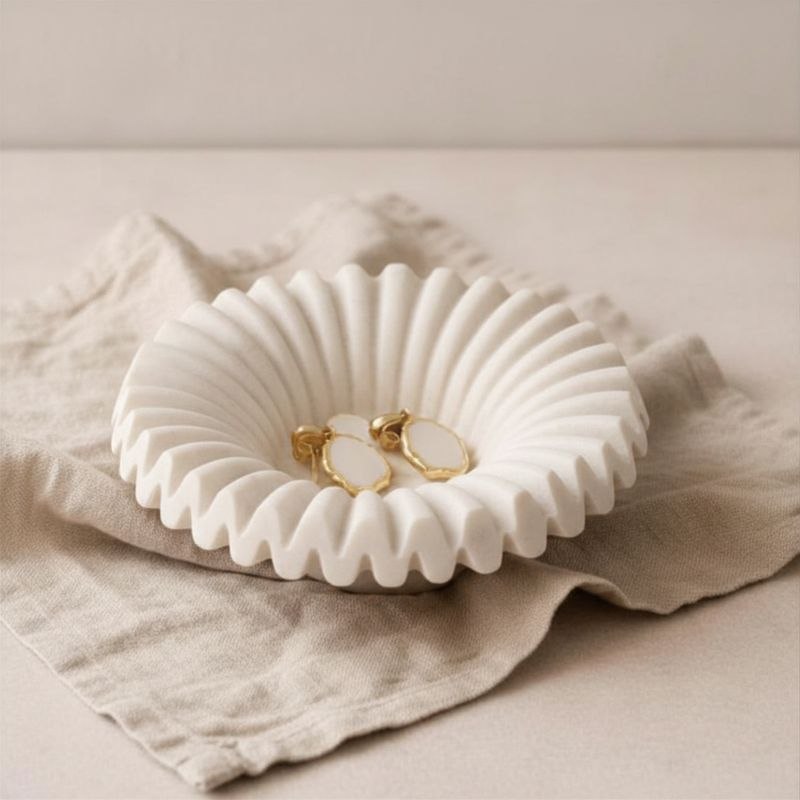 Ripple tray with natural finish with gold ear rings on fabric