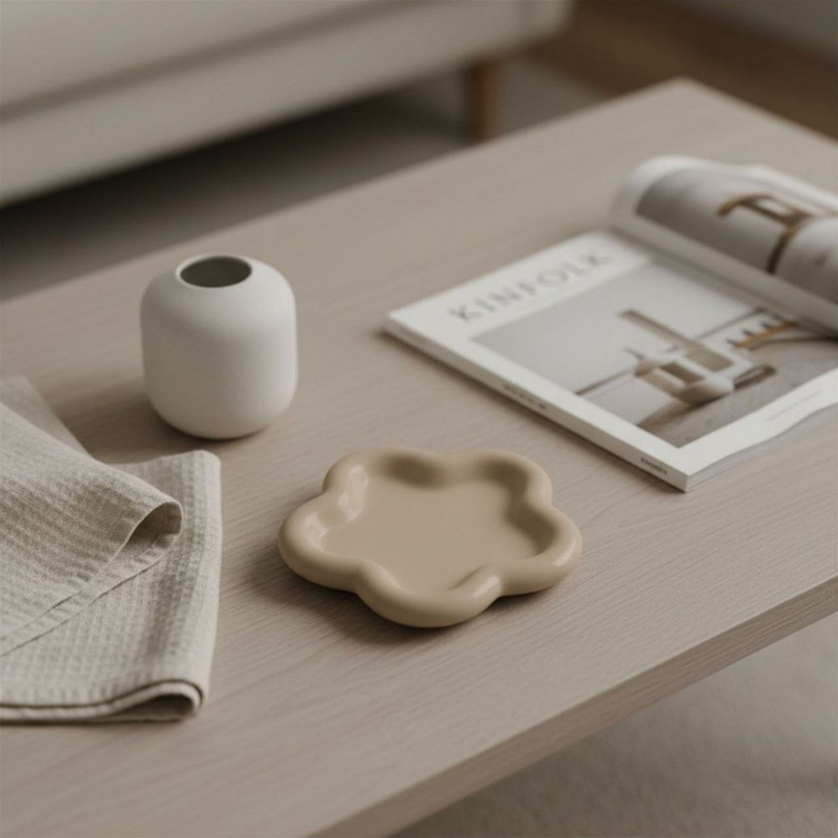 Flower tray in beige finish with ceramic vase, magazine and fabric