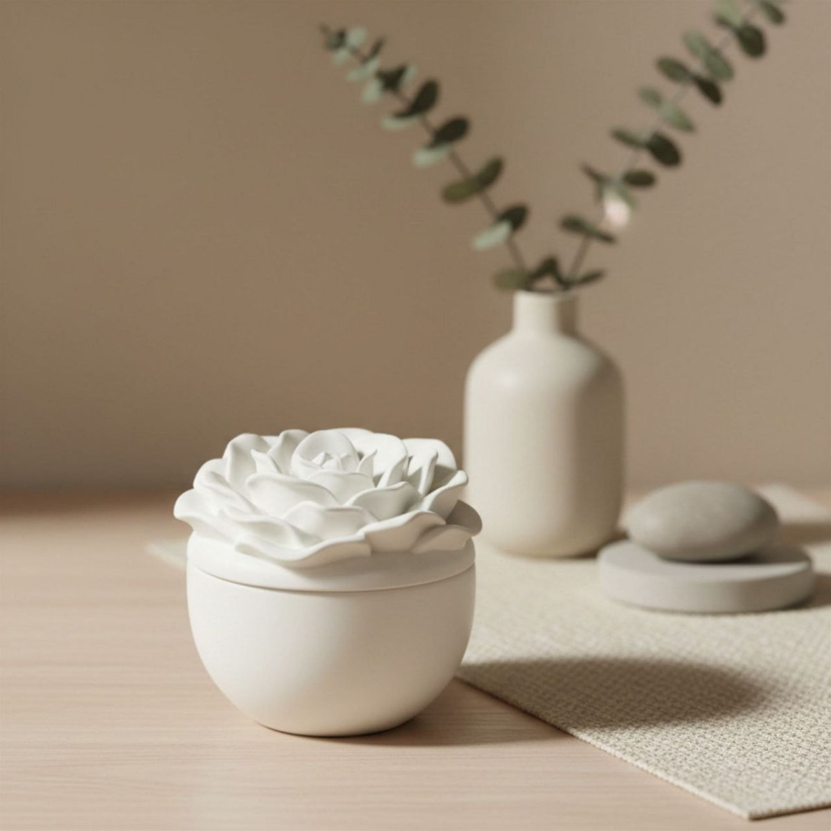 Rose jar and lid in a natural finish with a ceramic vase