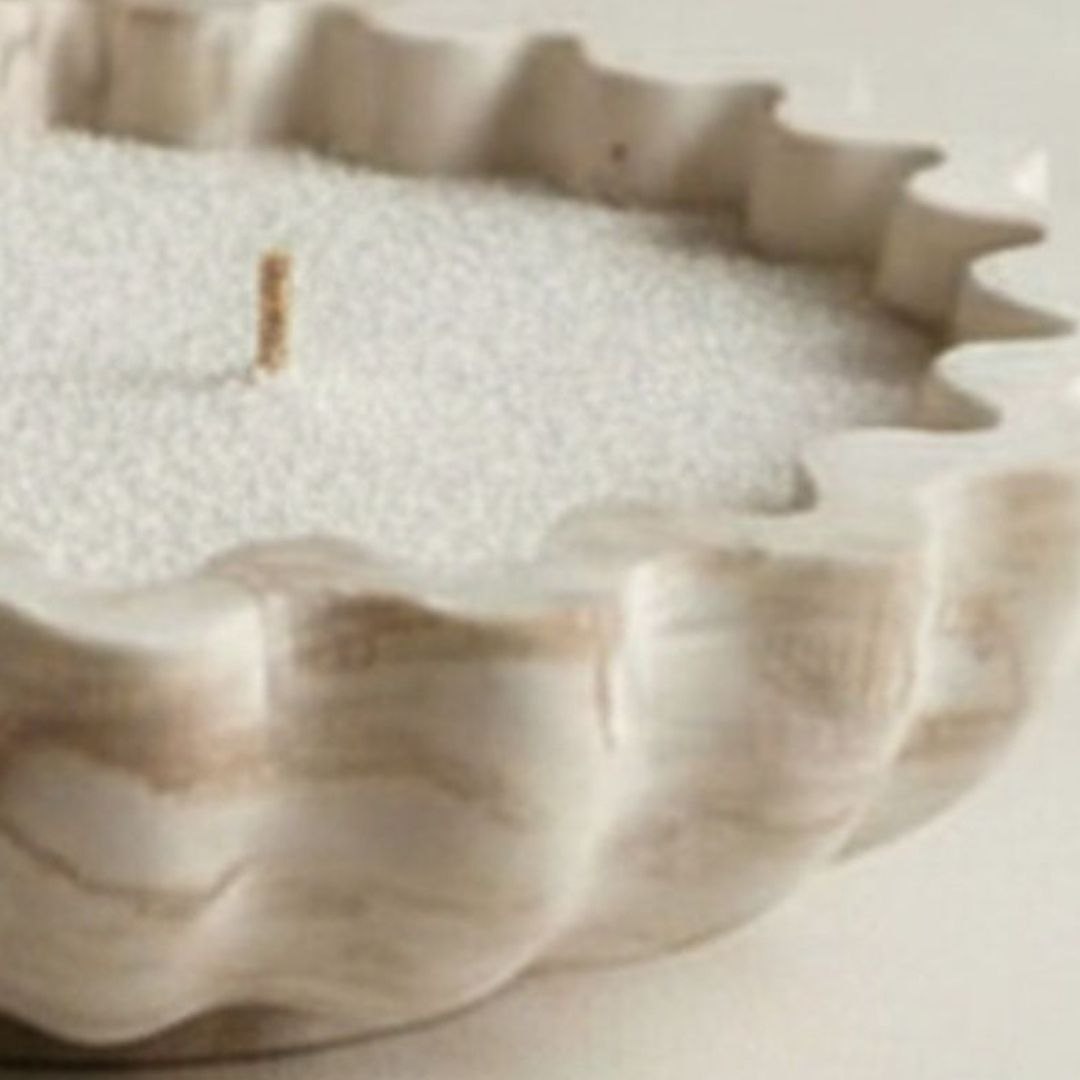 Close up of fluted bowl in a beige marble finish