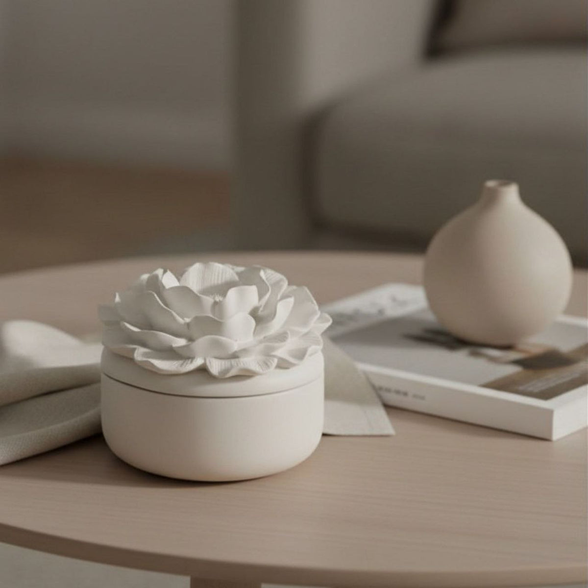 Camelia jar and lid with a natural finish on a table with neutral decor