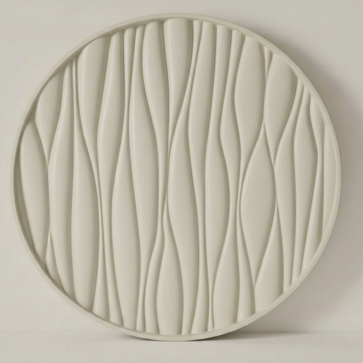 Round decorative tray with wavy texture with a beige finish