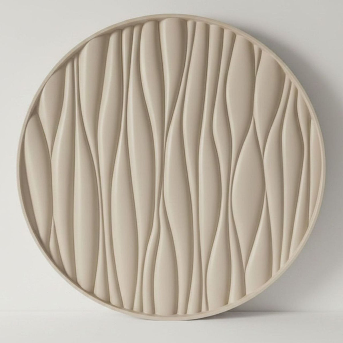 Round decorative tray with wavy texture with a taupe finish