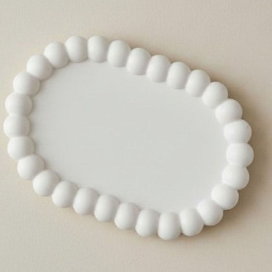 Oval bubble tray in natural finish